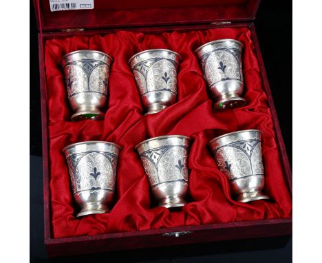 A set of 6 Russian silver and niello drinking tots, engraved folio decoration, height 6.5cm, 12.1oz total, boxedNo damage or 