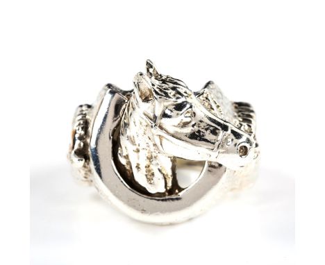 A large and heavy silver horse ring, with horseshoe motif, setting height 31.8mm, size Y, 86.5gNo damage or repairs, only lig
