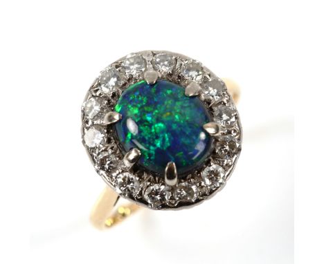 An 18ct gold black opal and diamond oval cluster ring, set with oval cabochon opal and modern round brilliant-cut diamonds, t