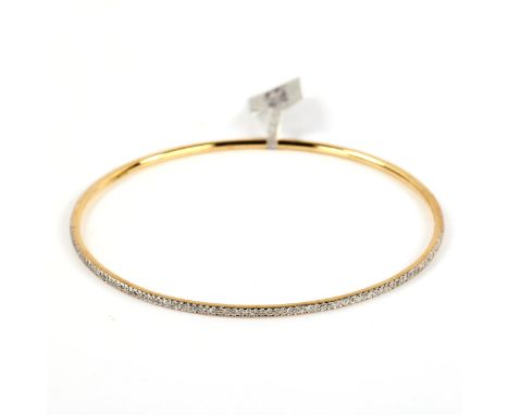 A modern 9ct gold diamond slave bangle, set with single-cut diamonds, total diamond content approx 0.57ct, band width 1.8mm, 
