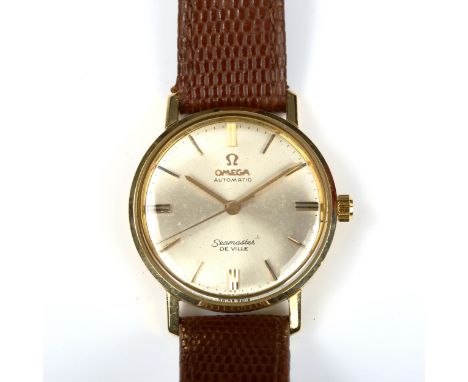 OMEGA - an 18ct gold Seamaster De Ville automatic wristwatch, silvered dial with baton hour markers and a sweep centre second
