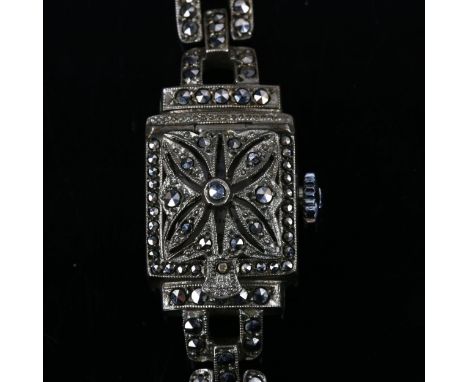 BUCHERER - a lady's Continental silver and marcasite mechanical bracelet watch, silvered dial with quarterly Arabic numerals,
