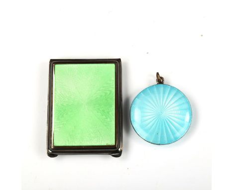 An Art Deco silver and green enamel matchbook case holder, and a miniature silver and blue enamel compact, diameter 4cm (2)Gr