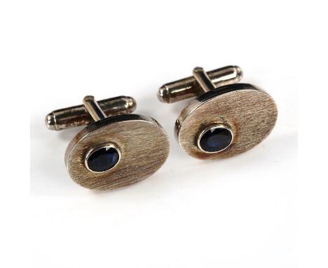 A pair of sterling silver Sri Lankan sapphire oval cufflinks, textured design, panel length 20.5mm, 11.1gNo damage or repairs