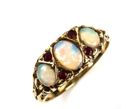 A 9ct gold seven stone opal and ruby half hoop ring, set with oval cabochon opal and round-cut ruby, setting height 8.1mm, si