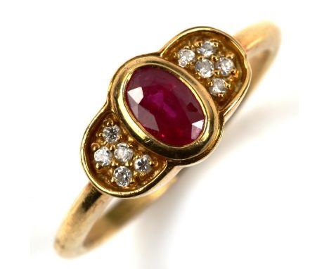 A modern 18ct gold ruby and diamond dress ring, set with oval mixed-cut ruby and round-cut diamonds, setting height 8.2mm, si