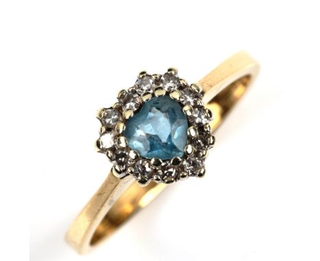 A modern 9ct gold blue topaz and diamond heart cluster ring, setting height 8.8mm, size M, 2.2gNo damage or repairs, all ston