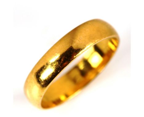 A mid-20th century 22ct gold wedding band ring, hallmarks London 1965, band width 4.3mm, size N, 3.9gNo damage or repairs, on