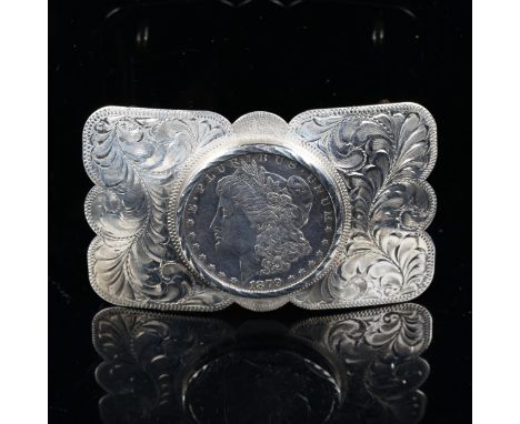 An American sterling silver dollar belt buckle, engraved foliate decoration, by Boyd-Reno of Nevada, 8cm x 5cm, 2.5ozNo damag