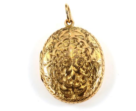 A Victorian 9ct gold oval photo locket pendant, allover engraved floral decoration, pendant height excluding bale 35.3mm, 8.6