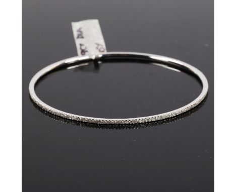 A modern 9ct white gold diamond slave bangle, set with single-cut diamonds, total diamond content approx 0.57ct, band width 1
