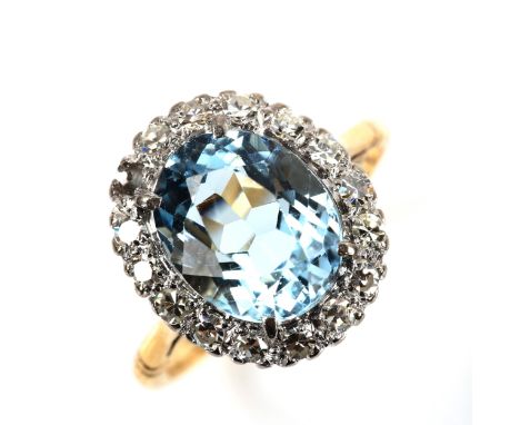 An 18ct gold aquamarine and diamond oval cluster ring, set with oval mixed-cut aqua and single-cut diamonds, aqua measures: 1