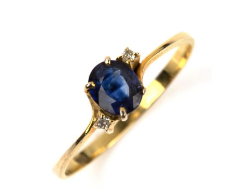 A modern 14ct gold three stone sapphire and diamond crossover ring, setting height 5.4mm, size O, 1gNo damage or repairs, all