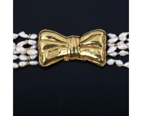 A 1970s 6-strand freshwater pearl necklace, on 18ct gold bow clasp, necklace length 40cm, 54.8gAll pearls present, no broken 