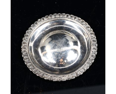 A George IV Scottish silver dish, relief cast acanthus border with a convex centre and engraved crown, by Charles Bendy, hall