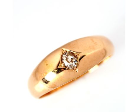 An early 20th century 15ct gold 0.15ct solitaire diamond gypsy ring, set with old-cut diamond, diamond weight calculated from