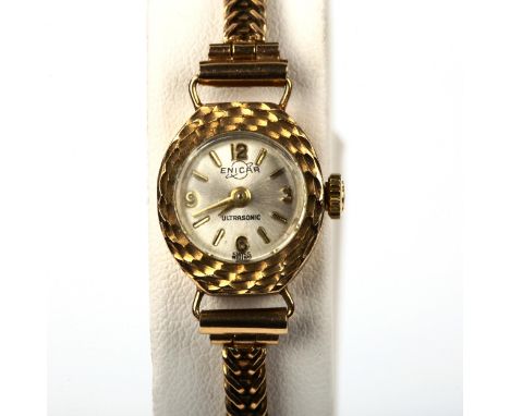 ENICAR - a lady's 9ct gold Ultrasonic mechanical bracelet watch, silvered dial with gilt quarterly Arabic numerals, textured 