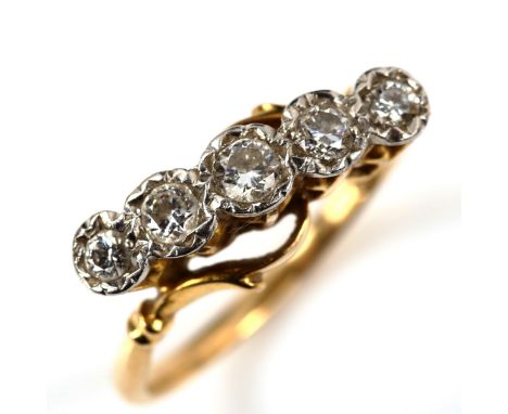 An 18ct gold graduated five stone diamond crossover ring, illusion set with modern round brilliant-cut diamonds, total diamon