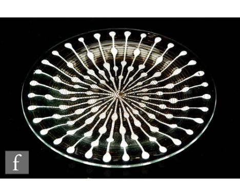 Michael and Frances Higgins - A contemporary studio glass dish of circular section, the clear frosted glass with fused radial