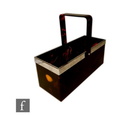 An Art Deco style lucite and chromed champagne carrier, the rectangular form container with swing hinged flat handle, surmoun