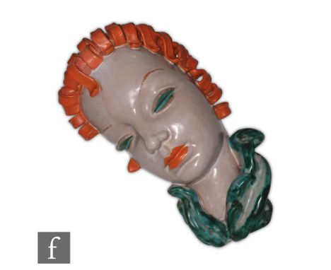 Goldscheider - A 1930s Art Deco wall mask modelled as a female head in profile with orange curled hair and a blue scarf, prin