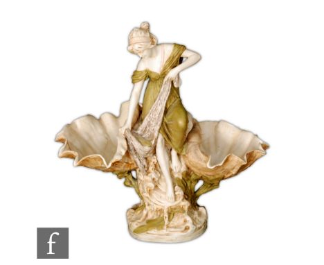 Royal Dux - An early 20th Century Art Nouveau table centre modelled as a maiden perched on a naturalist base pulling her fish