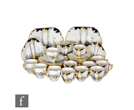 Eric Slater - Shelley - A 1930s Art Deco Queen Anne shape Sunrise and Tall Trees part tea set comprising twelve cups, saucers