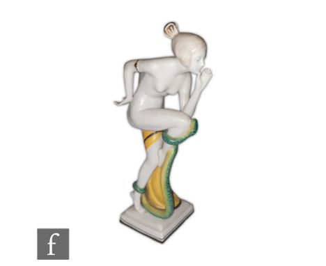 Unknown - A 1930s continental Art Deco figure of a snake charmer, the nude female stood on one leg with a dancing snake curle