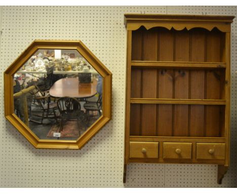 A pine wall hanging open shelf, shaped cornice, above three shelves, three spice drawers to base;  a pine mirror (2)