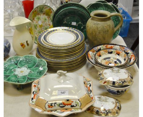 A part Victorian majolica green leaf dessert service, comprising comport and a pair of plates; an English pottery shaped dess