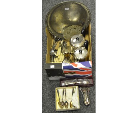 An early 20th century four-piece silver plated tea service, ebonised handles, c.1940; a planished pewter oval tray; Victorian