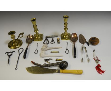 A Victorian corkscrew; 19th century folding button hooks (2); others (3); an early 20th century clay pipe, the bowl moulded a