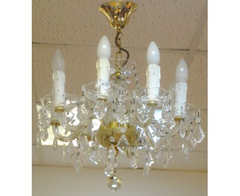 A contemporary eight light chandelier