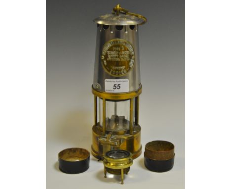 An Eccles Type 6 Miner's Protector lamp; a Victorian brass tripod lens, cased (2)