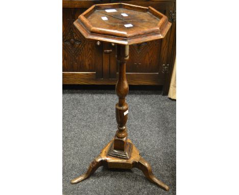 A Dutch 18th century oak candle stand, turned support, tripod feet 