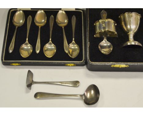 A George IV silver three piece christening set, egg cup, spoon and napkin ring, Birmingham 1932, cased;  a cased set of tea s