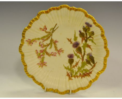 A Royal Worcester fluted shaped circular plate, printed and painted with thistles, gilt banded border, shape 1416