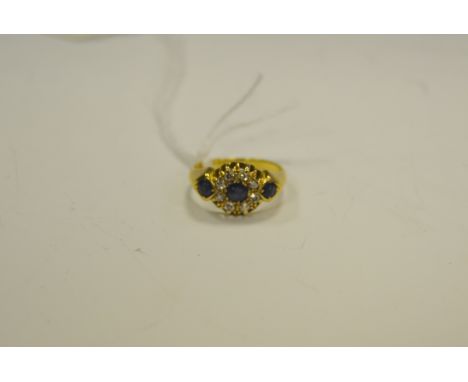 A sapphire and diamond cluster ring, 18ct gold shank