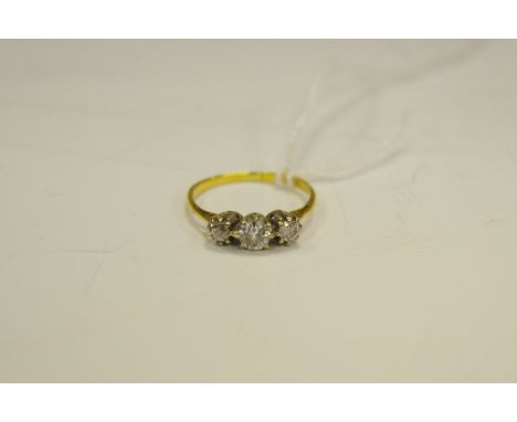 A three stone diamond ring, brilliant cut, 18ct gold shank