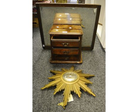 A mid 20th century gilt sunburst wall clock, 10cm silvered circular dial inscribed Finnigans, An Elliot Clock, chapter ring w