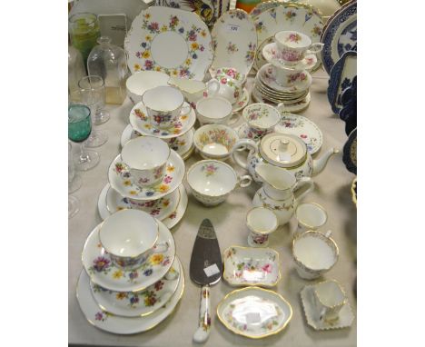 A New Chelsea tea service, printed with colourful country flowers, c.1935; a Royal Albert Poppy August tea cup and lobed sauc