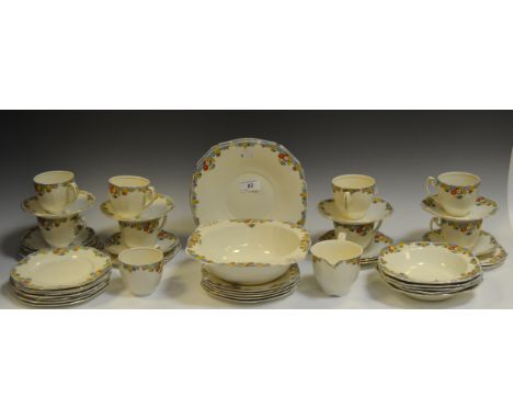 An Alfred Meakin 'Tweed' pattern part tea service comprising of two bread and butter plates, dessert service and cups and sau