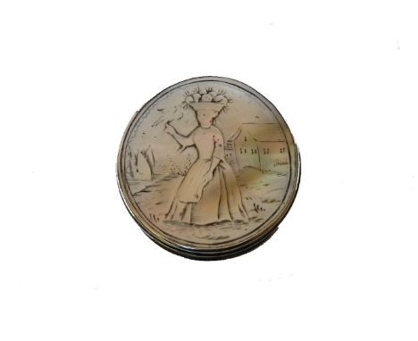 A mother of pearl mounted silver snuff box, the carved cover depicting a Dutch lady, a bird perched on her finger, 4.5cm diam