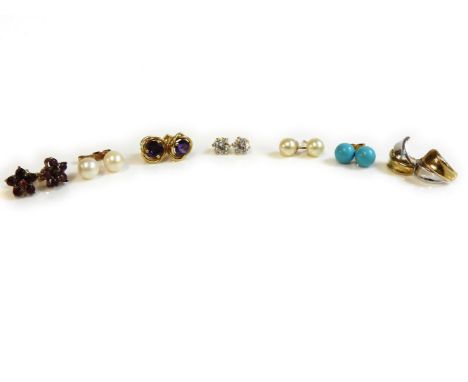 A pair of gold garnet cluster earrings, a pair of cubic zirconia studs, two pairs of gold pearl studs, a pair of gold reconst