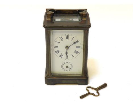 A brass carriage clock, the bell strike movement and subsidiary hour dial (face af)