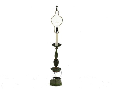 A carved gilt wood torchere stand, 106cm tall, together with a green toleware table lamp, 110cm tall