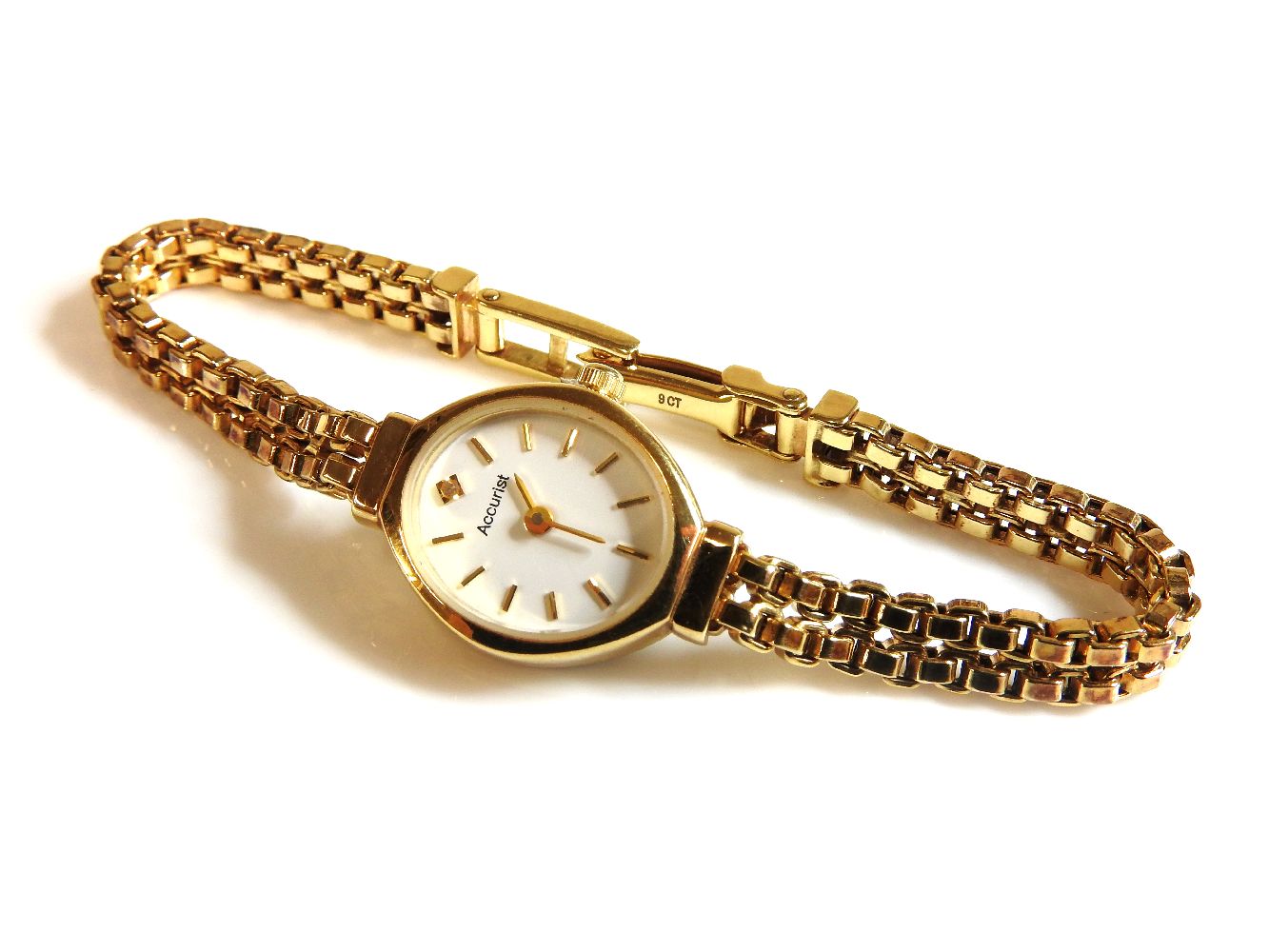 A 9ct gold ladies Accurist quartz bracelet watch, with two row box