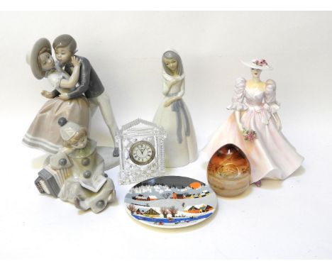 Three Lladro figure groups, a Poole pottery collectors plate, and another similar