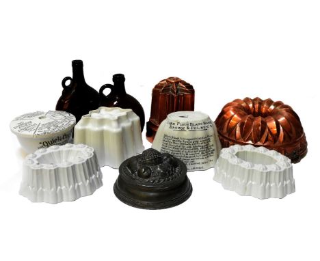 Two Victorian copper jelly moulds, four pottery jelly moulds, a pudding basin, a Victorian ice cream mould and two glass bott