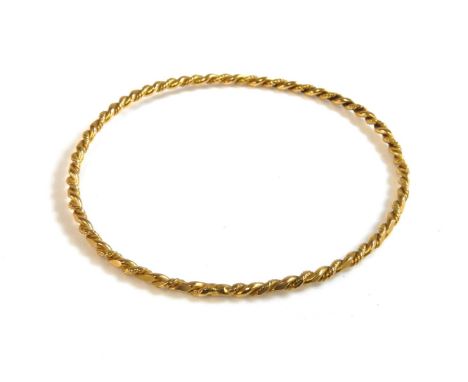 A gold twisted rope slave bangle, tested as 9ct gold, 8.68g